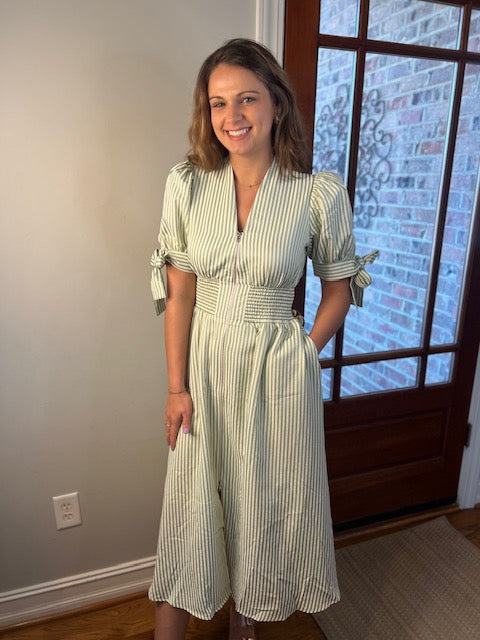 Pin stripe short puff sleeve midi dress. It is a light green pin stripe. zip up front detail, pockets, lined, 100% polyster 