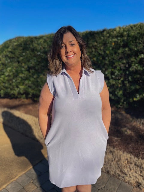 Textured solid collared v neck, sleeveless, has pockets, lilac color, 95% polyester 5% spandex